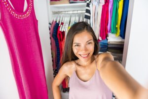 Selfie Asian girl taking photo with mobile phone of herself in c