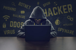 Cyber criminal stealing secrets with laptop