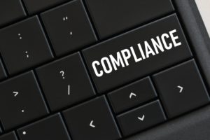 computer-keyboard-with-a-compliance-button-concept-8PNSTAU