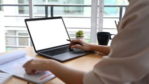 cropped-shot-of-businesswoman-working-with-compute-YFSGCA3
