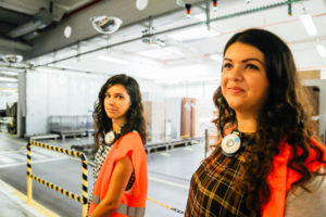 latino-women-in-manufacturing-factory-wearing-personal-protective-equipment-ppe_t20_EOYrQK