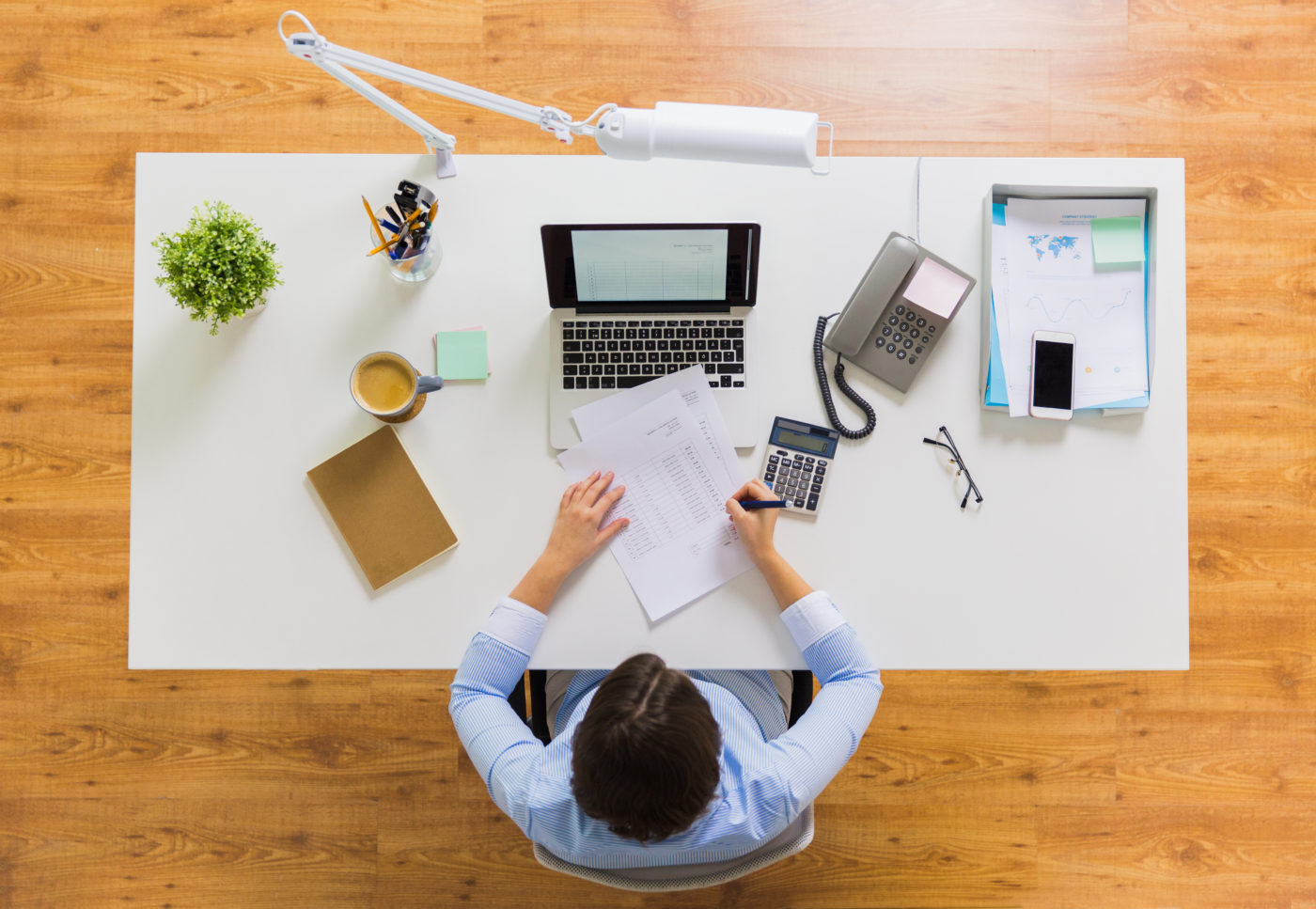 businesswoman with tax report at office