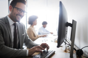 Programmers cooperating at IT company developing apps