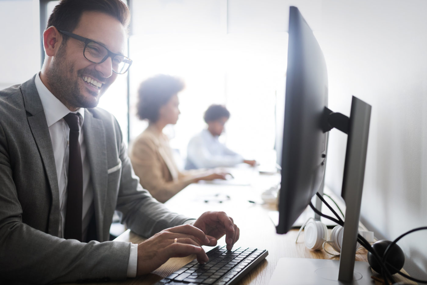 Programmers cooperating at IT company developing apps