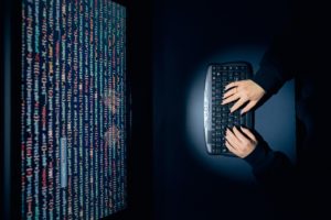 Cyber security threat. Young woman using computer and coding. Internet and network security. Stealing private information. Person using technology to steal password and private data. Cyber attack crime