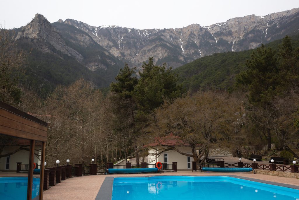 large outdoor swimming pool overlooking the snow-capped mountains