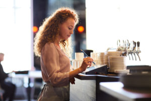 small business owner using a pos