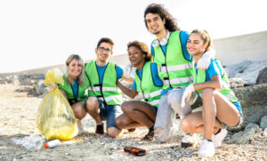 People group photo of young volunteers team wearing uniform at b